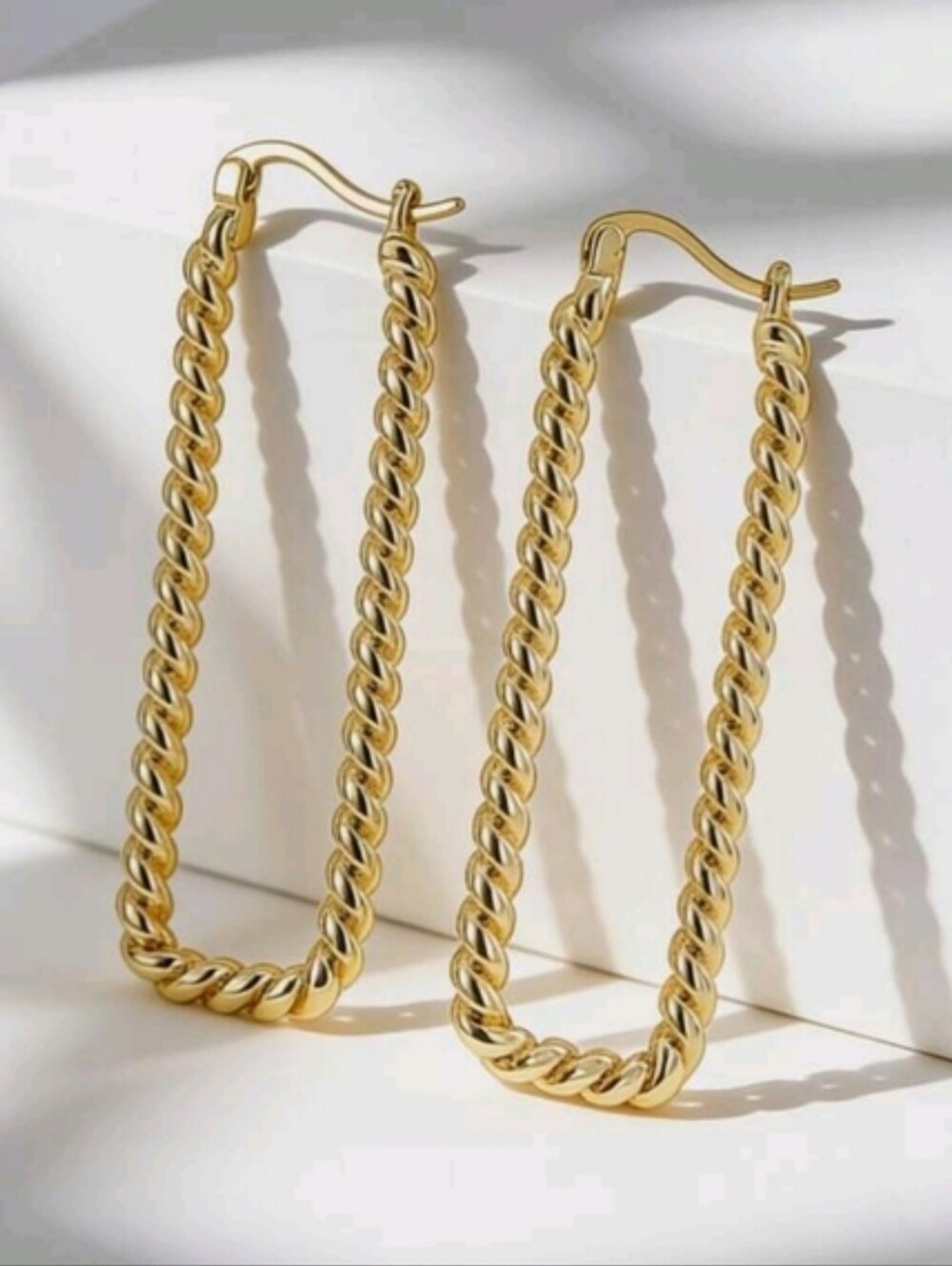 Gold plated twisted long rectangular hoop earrings; 1.96"x.59"; nwot